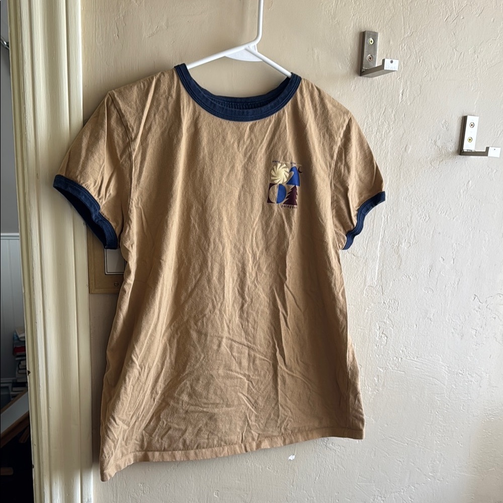 Patagonia Beige Ringer Tee with Navy Trim and Small Chest Graphic